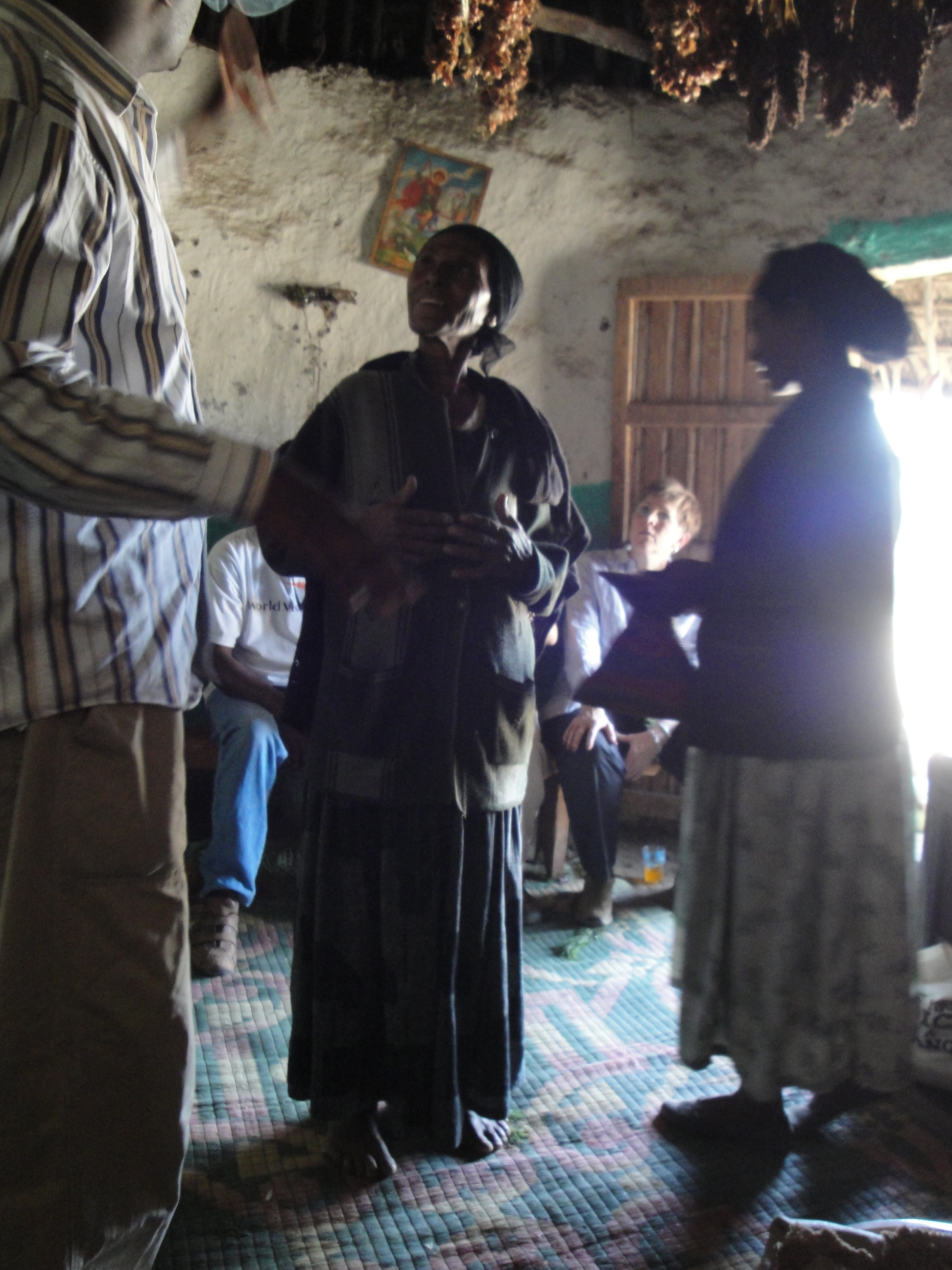 Si's grandmother invites us into her hut for coffee.